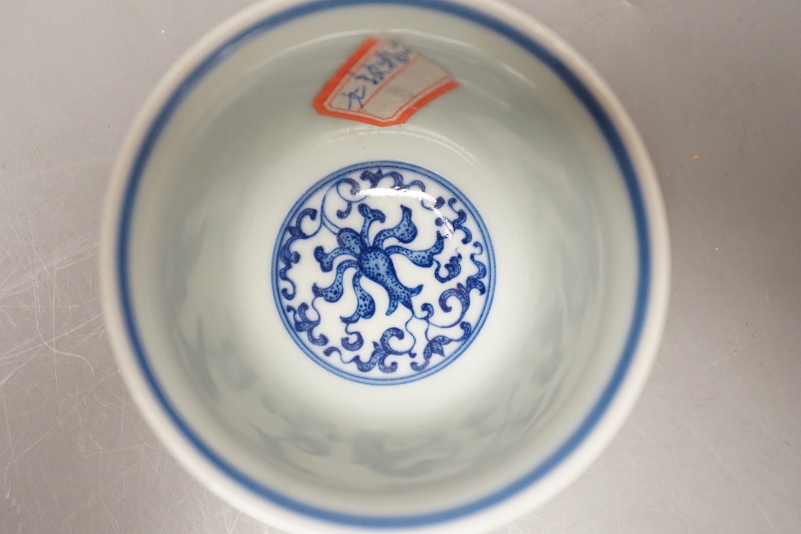 A Chinese blue and white 'lotus' cup. 9cm diameter